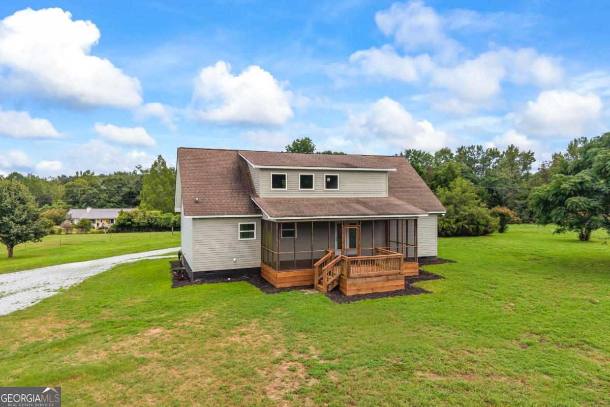 1718 Ed Bennett Road Nicholson, GA 30565 - Photo 64 of 71 front view of house with a big yard