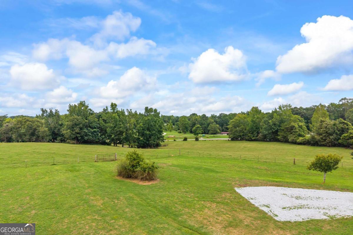 1718 Ed Bennett Road Nicholson, GA 30565 - Photo 69 of 71 a view of a golf course with a lake