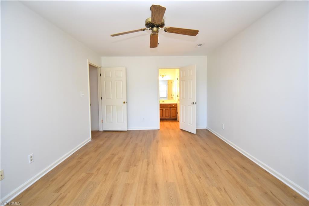 422 Wildwood Lane Graham, NC 27253 - Photo 13 of 22 Another view of the primary bedroom and its private en-suite.