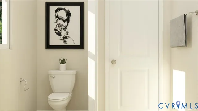a white toilet sitting next to a bathroom sink