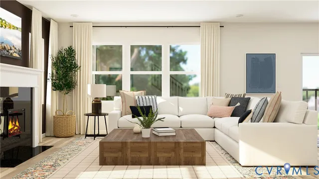 a living room with furniture and a floor to ceiling window