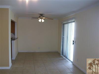 43376 Cook Street, Unit 127 Palm Desert, CA 92211 - Photo 2 of 31 wooden floor in an empty room with a window