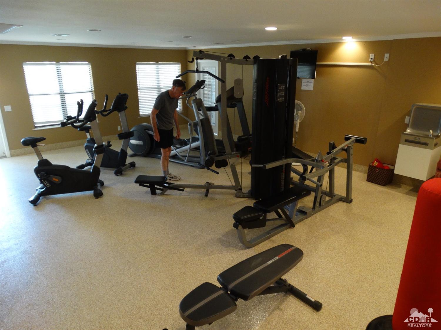 43376 Cook Street, Unit 127 Palm Desert, CA 92211 - Photo 21 of 31 a view of a room with gym equipment