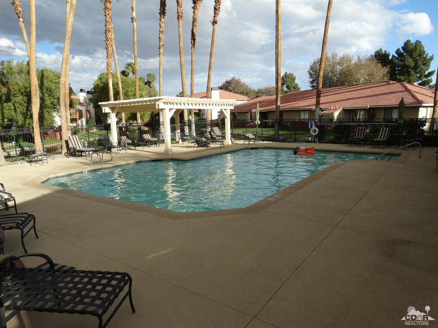 43376 Cook Street, Unit 127 Palm Desert, CA 92211 - Photo 27 of 31 a view of swimming pool with outdoor seating