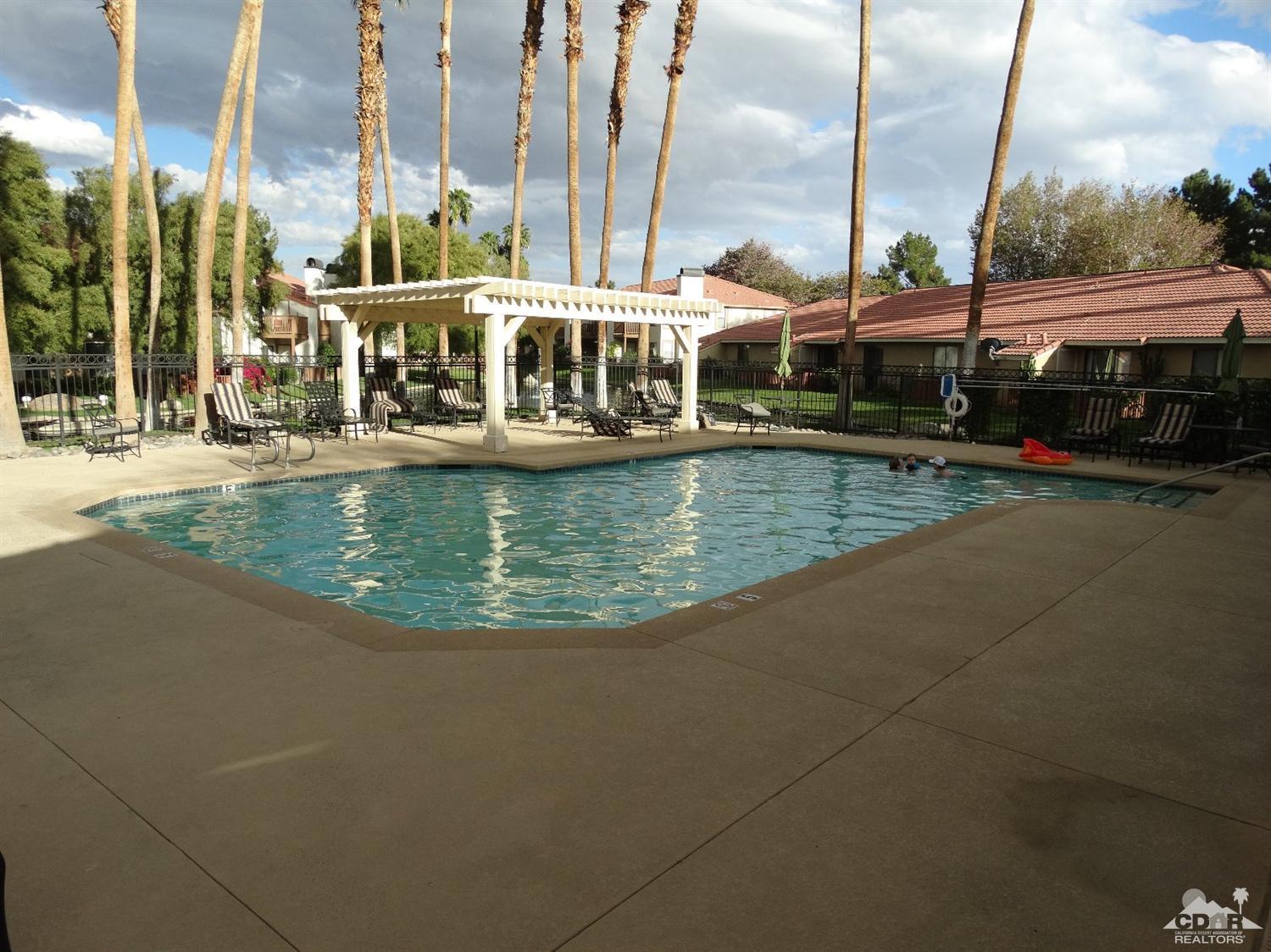 43376 Cook Street, Unit 127 Palm Desert, CA 92211 - Photo 28 of 31 a view of swimming pool with outdoor seating