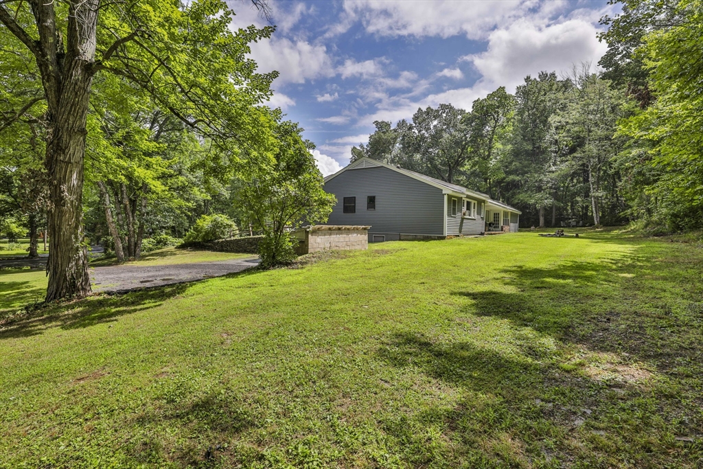 168 East Haynes Road Townsend, MA 01469 - Photo 20 of 23 a house with garden in front of it