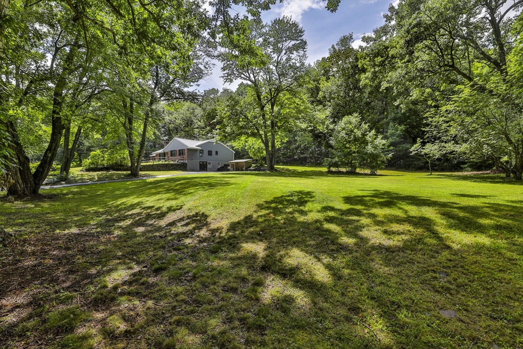168 East Haynes Road Townsend, MA 01469 - Photo 21 of 23 a backyard of a house with table and chairs