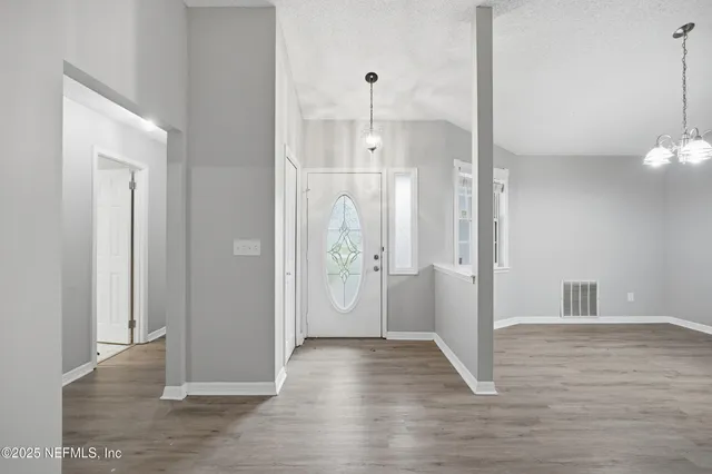 a view of a bathroom with wooden floor