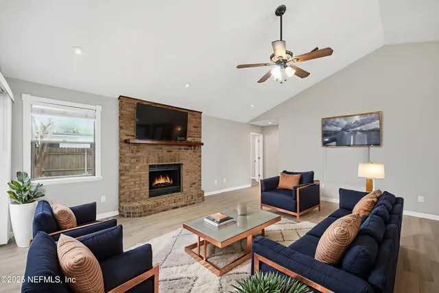 a living room with furniture a fireplace