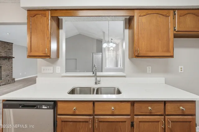 a kitchen with a sink and cabinets