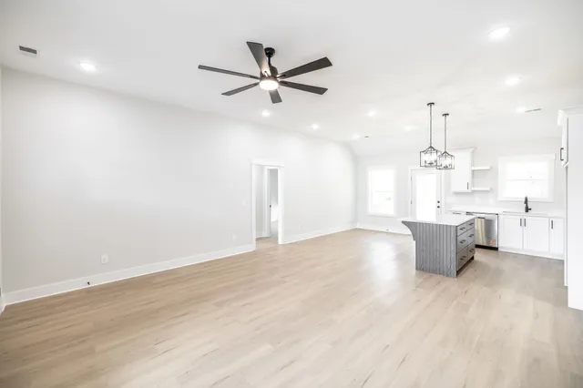 a view of a kitchen with a sink and a window