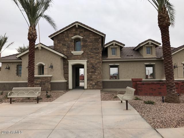 4156 East Cynthia Street Gilbert, AZ 85295 - Photo 6 of 25 a front view of a house with parking space