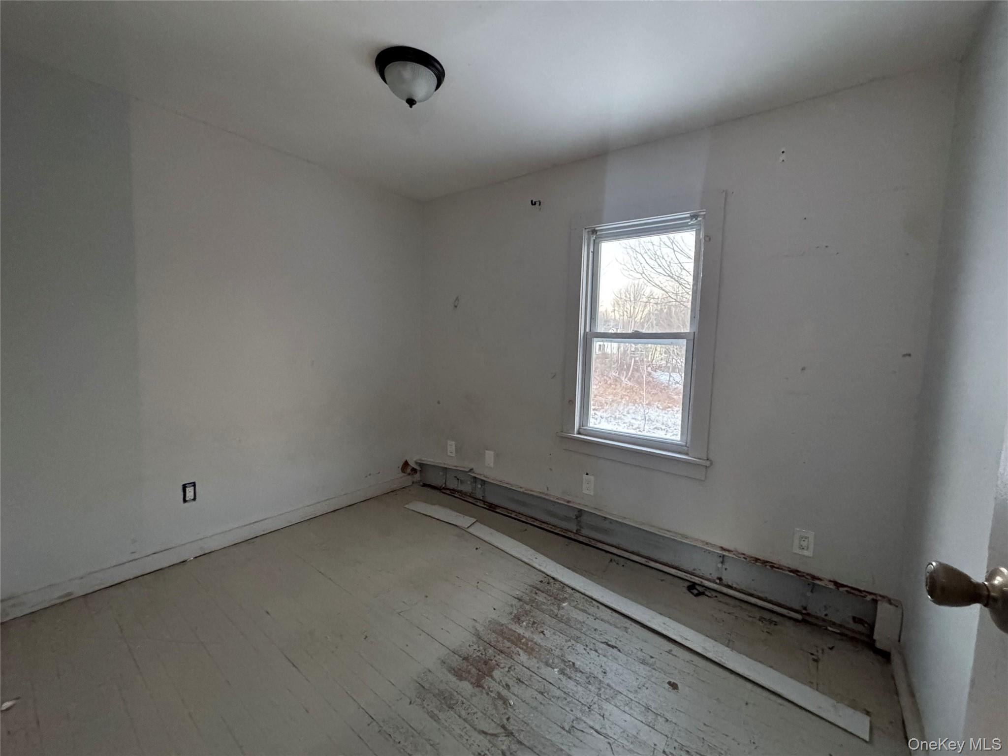 74 Cold Spring Road Liberty, NY 12754 - Photo 11 of 16 an empty room with a window