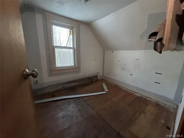 wooden floor and window in an empty room