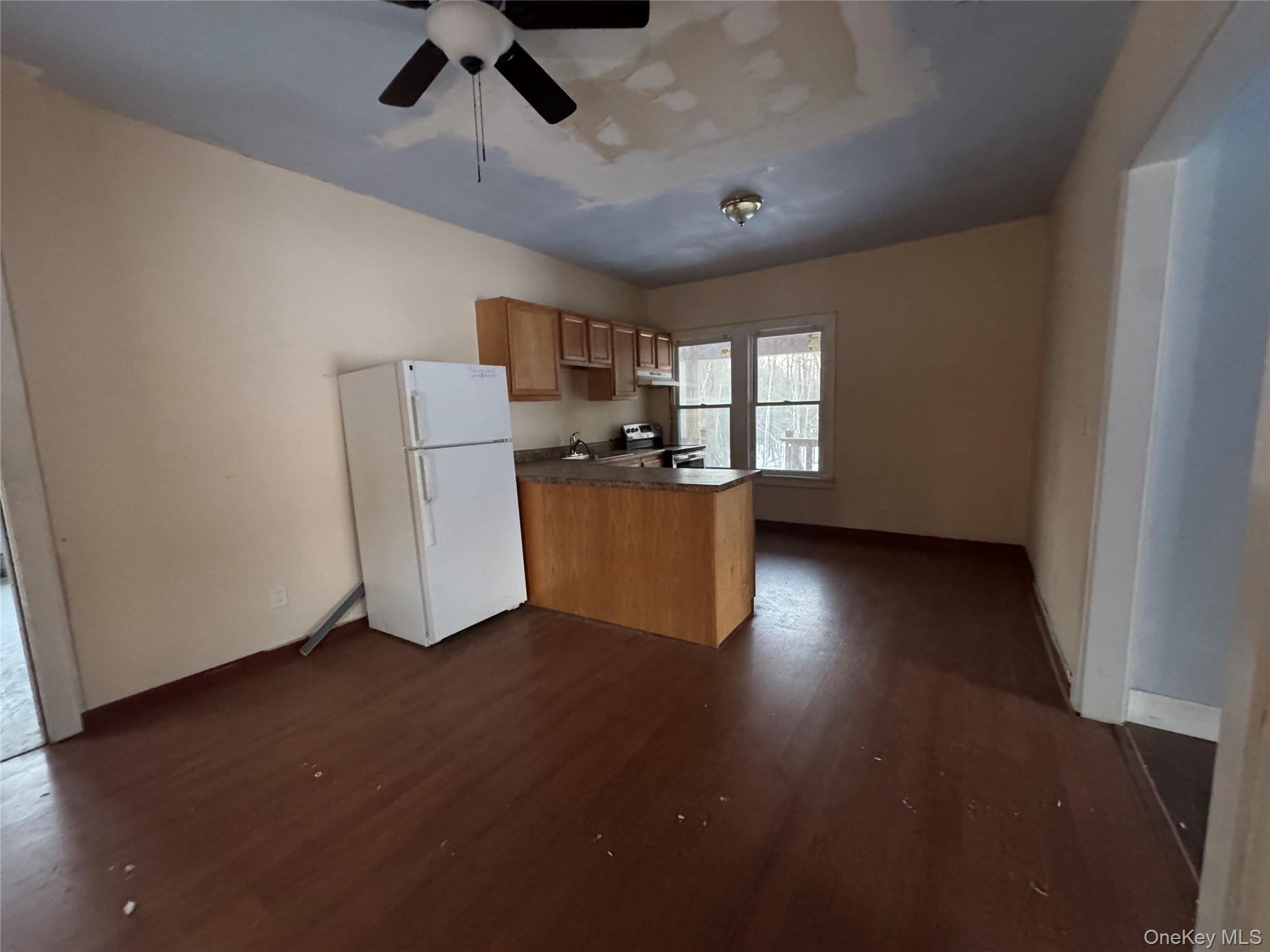 74 Cold Spring Road Liberty, NY 12754 - Photo 4 of 16 a view of a kitchen with a sink cabinets and wooden floor