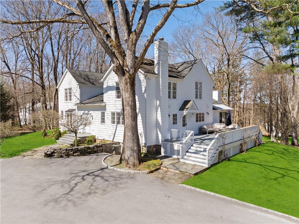 219 Hamilton Road Chappaqua, NY 10514 - Photo 1 of 1 a front view of house with yard and green space