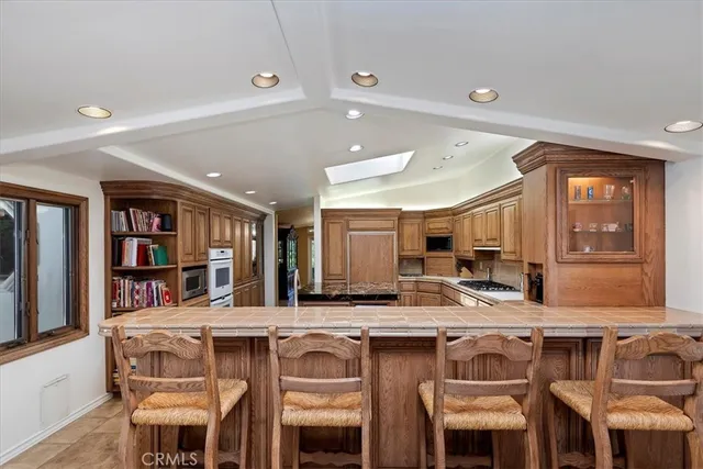 a kitchen with a table and chairs in it