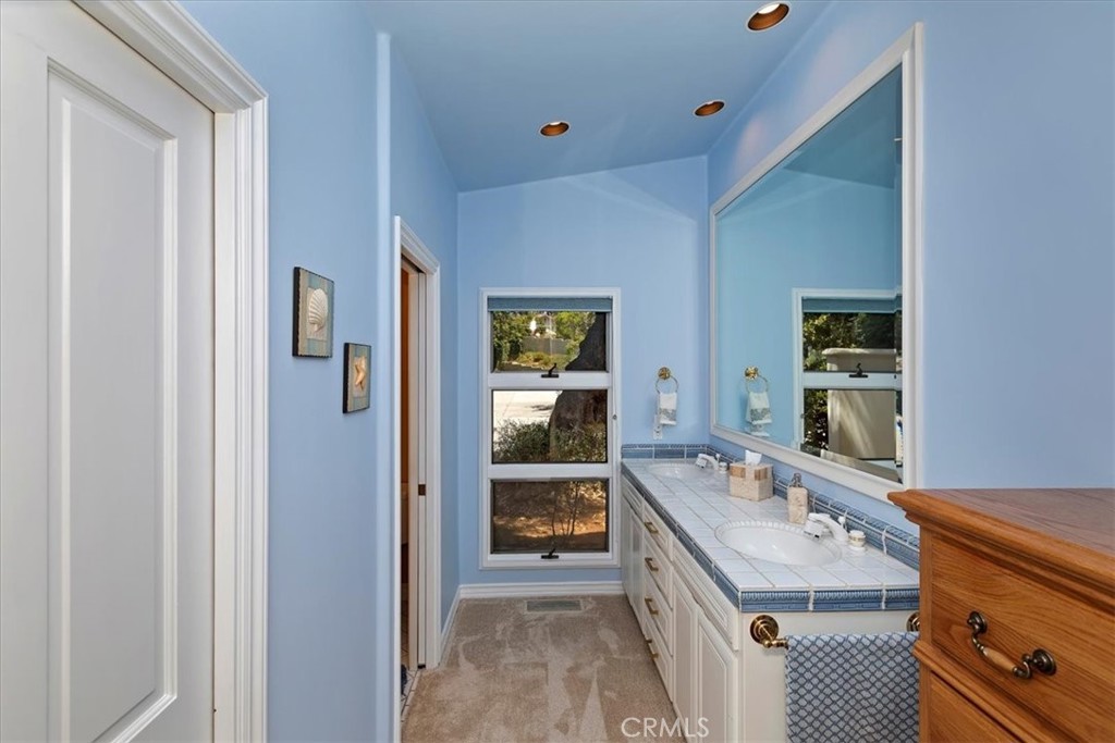 2100 Hathaway Place Riverside, CA 92506 - Photo 26 of 74 a bathroom with a sink and a mirror