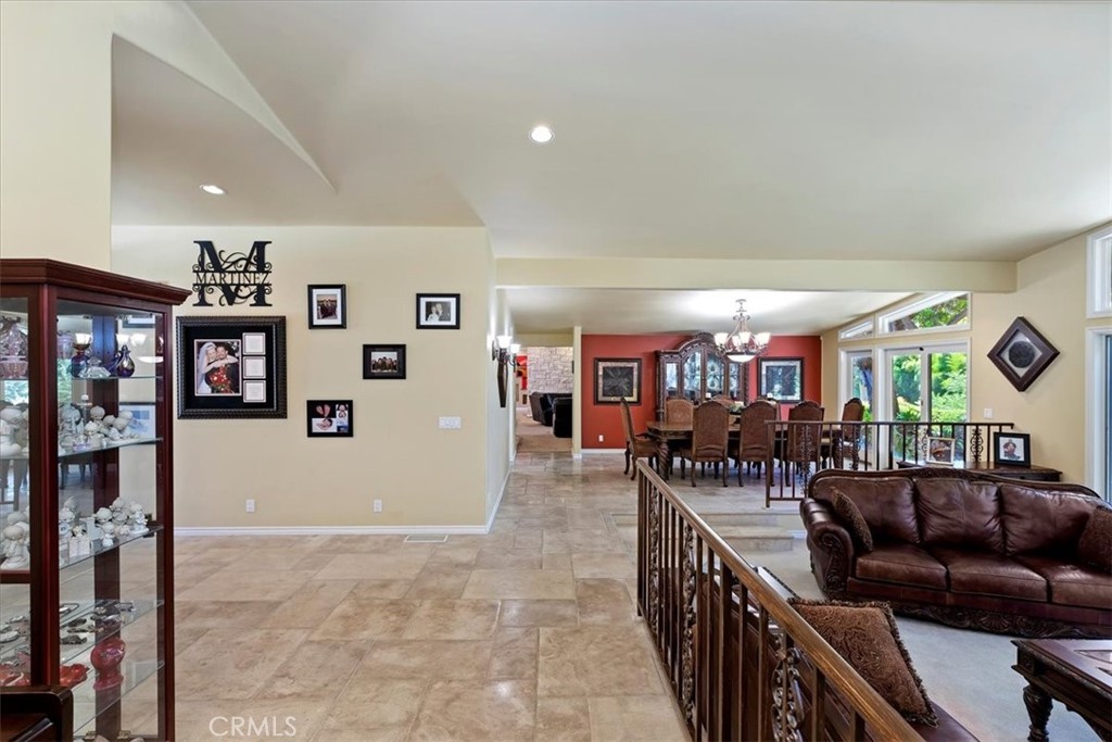 2100 Hathaway Place Riverside, CA 92506 - Photo 28 of 74 a living room with furniture and paintings on the wall