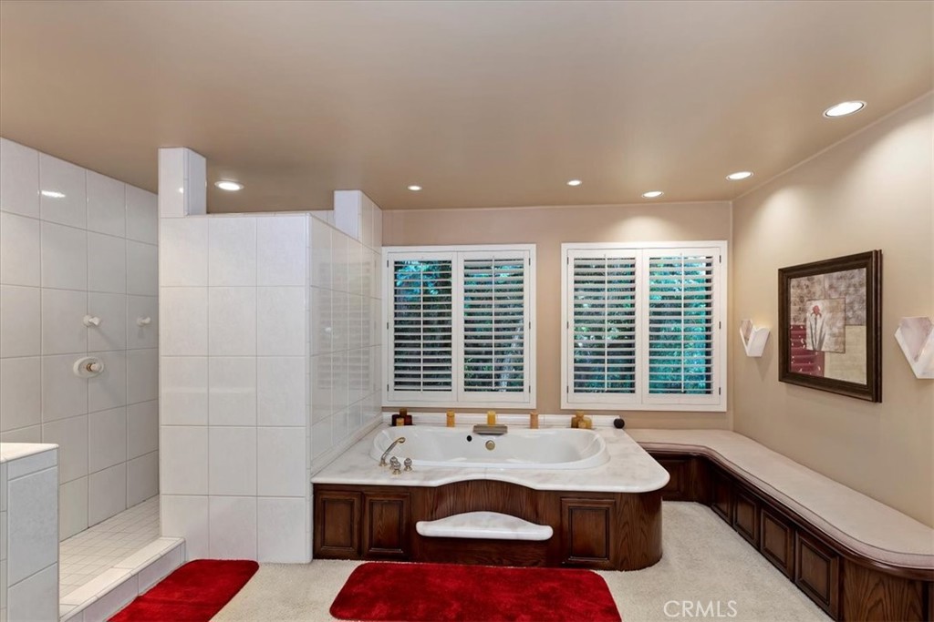 2100 Hathaway Place Riverside, CA 92506 - Photo 36 of 74 a bathroom with a tub sink and mirror