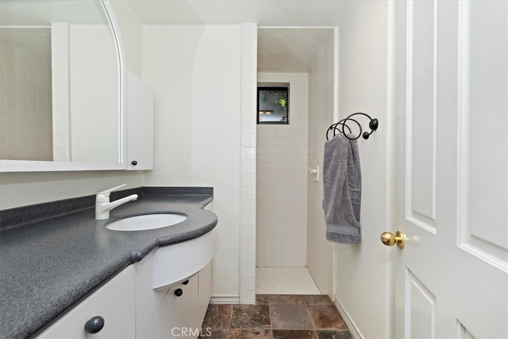 2100 Hathaway Place Riverside, CA 92506 - Photo 43 of 74 a bathroom with a sink and a mirror