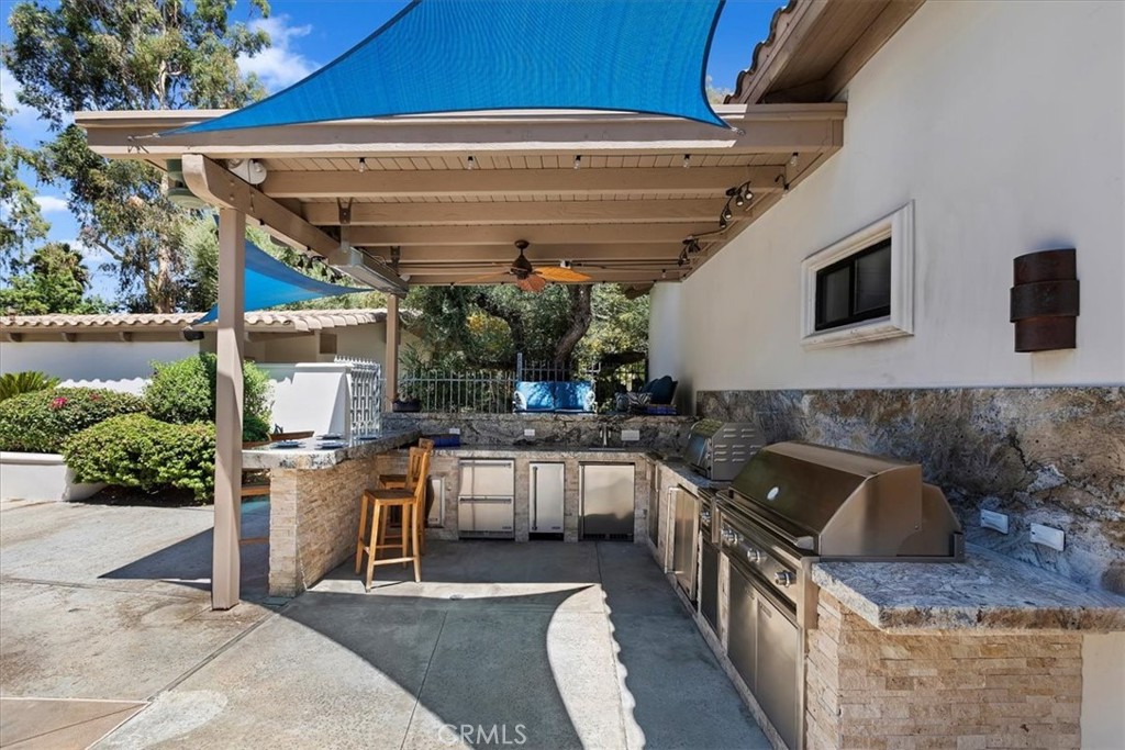 2100 Hathaway Place Riverside, CA 92506 - Photo 63 of 74 a kitchen with stainless steel appliances granite countertop a sink and a stove