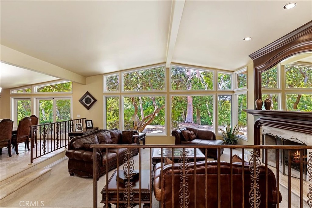 2100 Hathaway Place Riverside, CA 92506 - Photo 8 of 74 a living room with furniture a flat screen tv and a floor to ceiling window