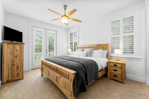 a bedroom with a bed and a television
