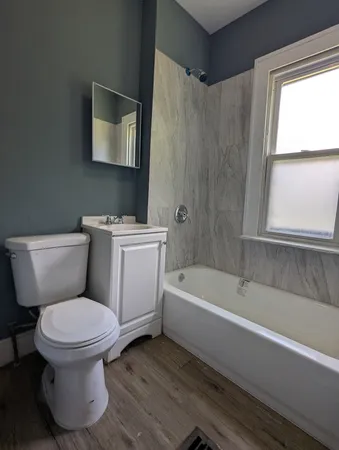a bathroom with a toilet sink and bathtub