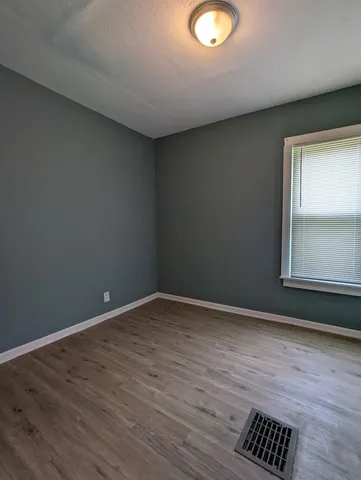 a view of an empty room and window