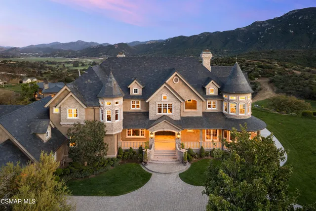 a room with lots of furniture and natural light