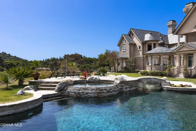 a view of a dining room with furniture and window