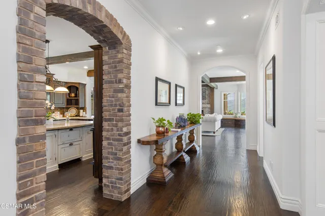 a bedroom with furniture and a large window