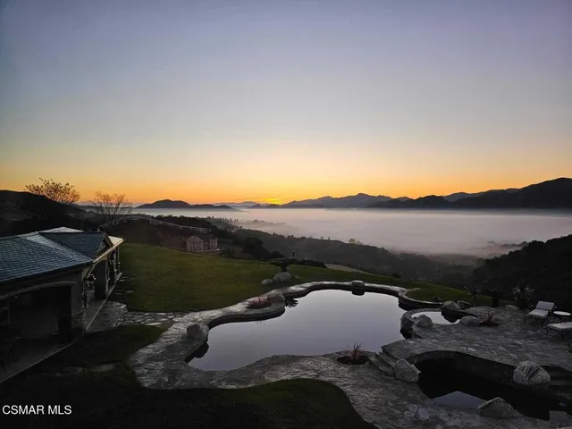 a view of a lake with mountain in the background
