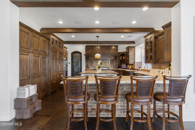a view of a house with swimming pool and sitting area