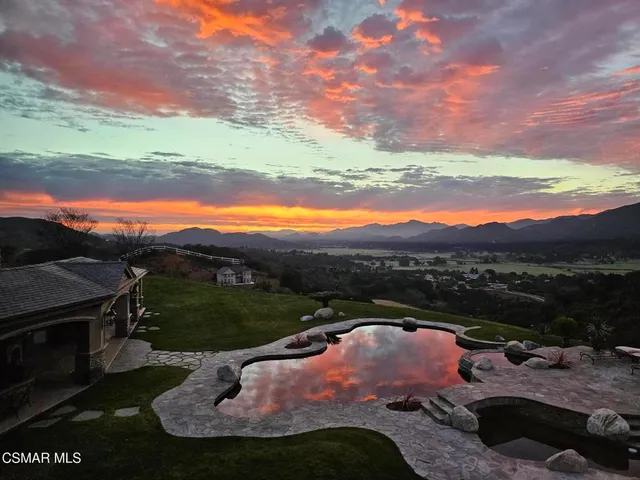 a view of a lake with a mountain and a lake view