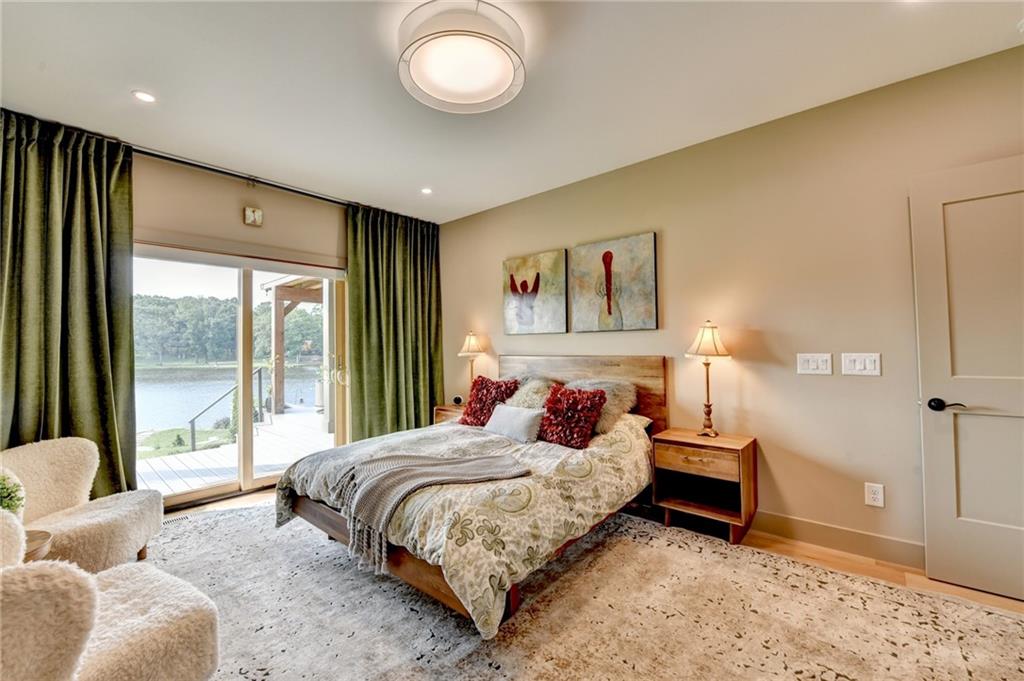 120 Mt Moriah Road Auburn, GA 30011 - Photo 23 of 48 a bedroom with a large bed and a large window