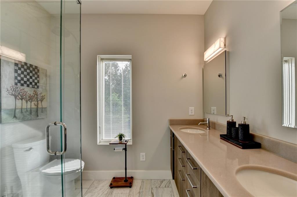 120 Mt Moriah Road Auburn, GA 30011 - Photo 32 of 48 a bathroom with double vanity sinks and a mirror