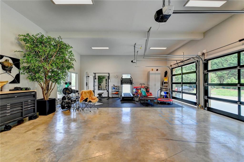 120 Mt Moriah Road Auburn, GA 30011 - Photo 35 of 48 a view of a garage with a lots of windows and potted plants