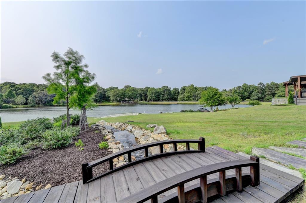 120 Mt Moriah Road Auburn, GA 30011 - Photo 40 of 48 a view of a yard with wooden floor and lake view