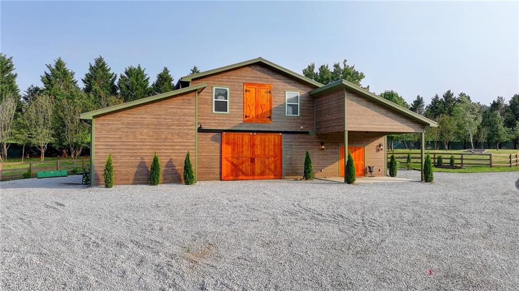 120 Mt Moriah Road Auburn, GA 30011 - Photo 41 of 48 a view of house with backyard and swimming pool