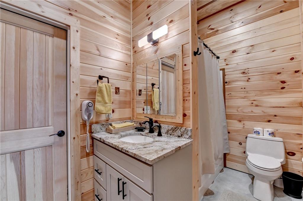 120 Mt Moriah Road Auburn, GA 30011 - Photo 44 of 48 a bathroom with a granite countertop sink toilet and shower