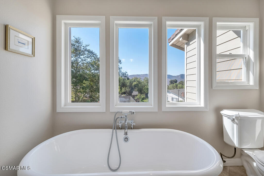 11780 Barranca Road Camarillo, CA 93012 - Photo 11 of 26 a white bath tub sitting next to a window