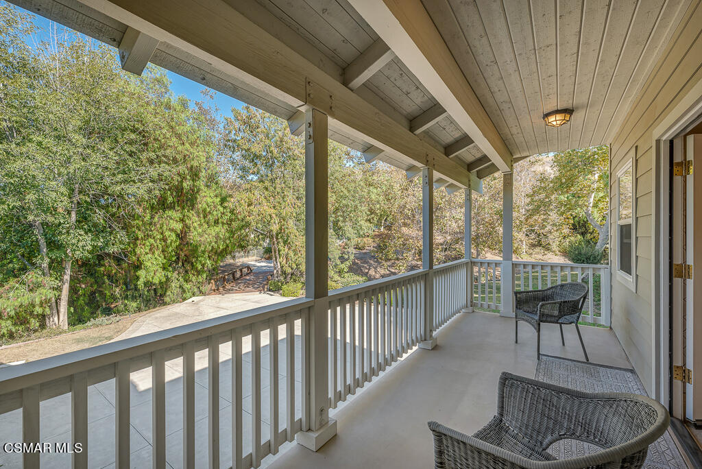 11780 Barranca Road Camarillo, CA 93012 - Photo 14 of 26 a balcony with chairs and a potted plant