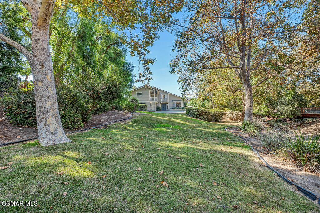 11780 Barranca Road Camarillo, CA 93012 - Photo 20 of 26 a view of a house with backyard and a tree