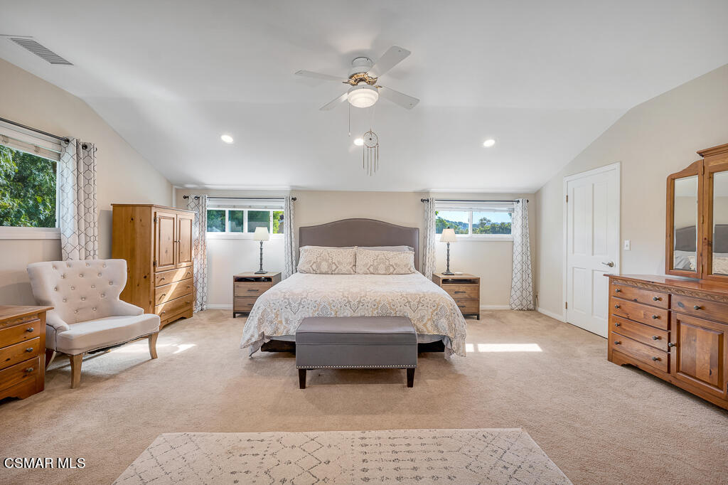 11780 Barranca Road Camarillo, CA 93012 - Photo 23 of 26 a spacious bedroom with a bed a couch and dresser