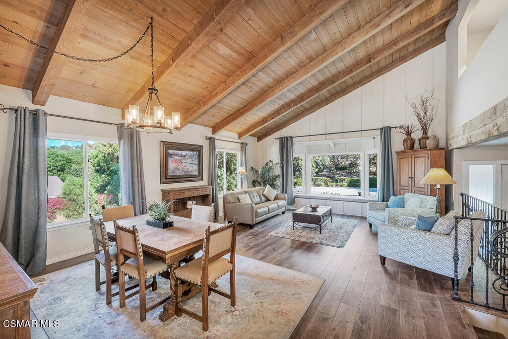 11780 Barranca Road Camarillo, CA 93012 - Photo 4 of 26 a dining room with furniture large windows and wooden floor