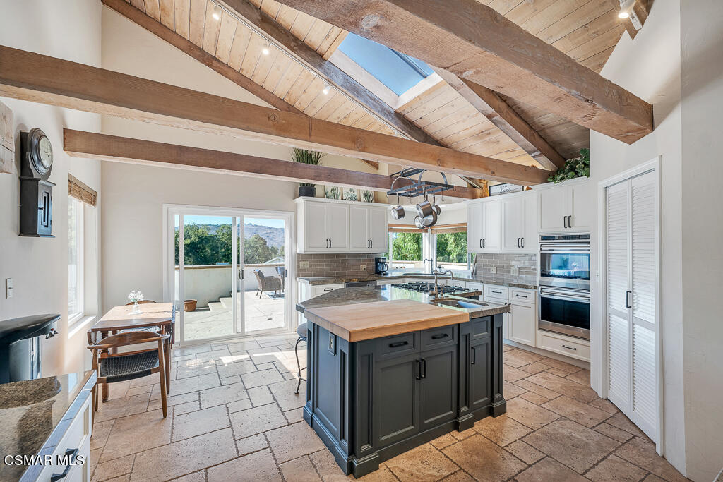 11780 Barranca Road Camarillo, CA 93012 - Photo 5 of 26 a kitchen with a stove a sink and a refrigerator