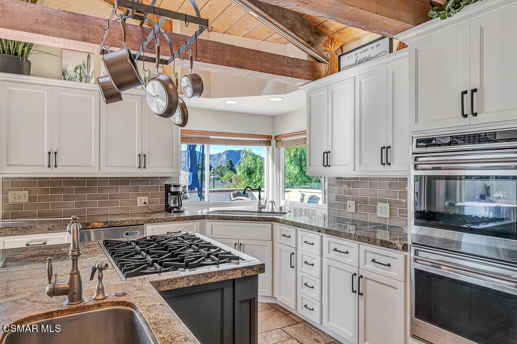 11780 Barranca Road Camarillo, CA 93012 - Photo 6 of 26 a kitchen with cabinets appliances a sink and a window