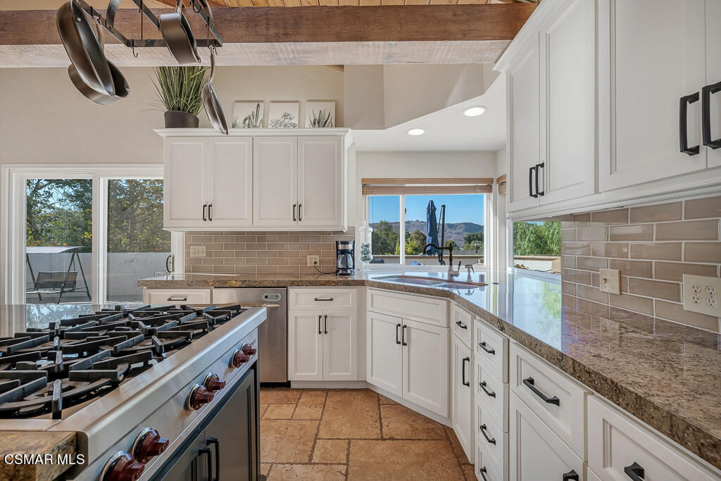11780 Barranca Road Camarillo, CA 93012 - Photo 7 of 26 a kitchen with cabinets and appliances